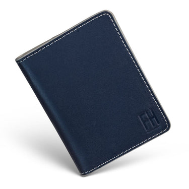 A navy blue slim RFID bifold wallet made of top grain leather, closed and displayed flat with visible stitching and embossed 'FH' logo.